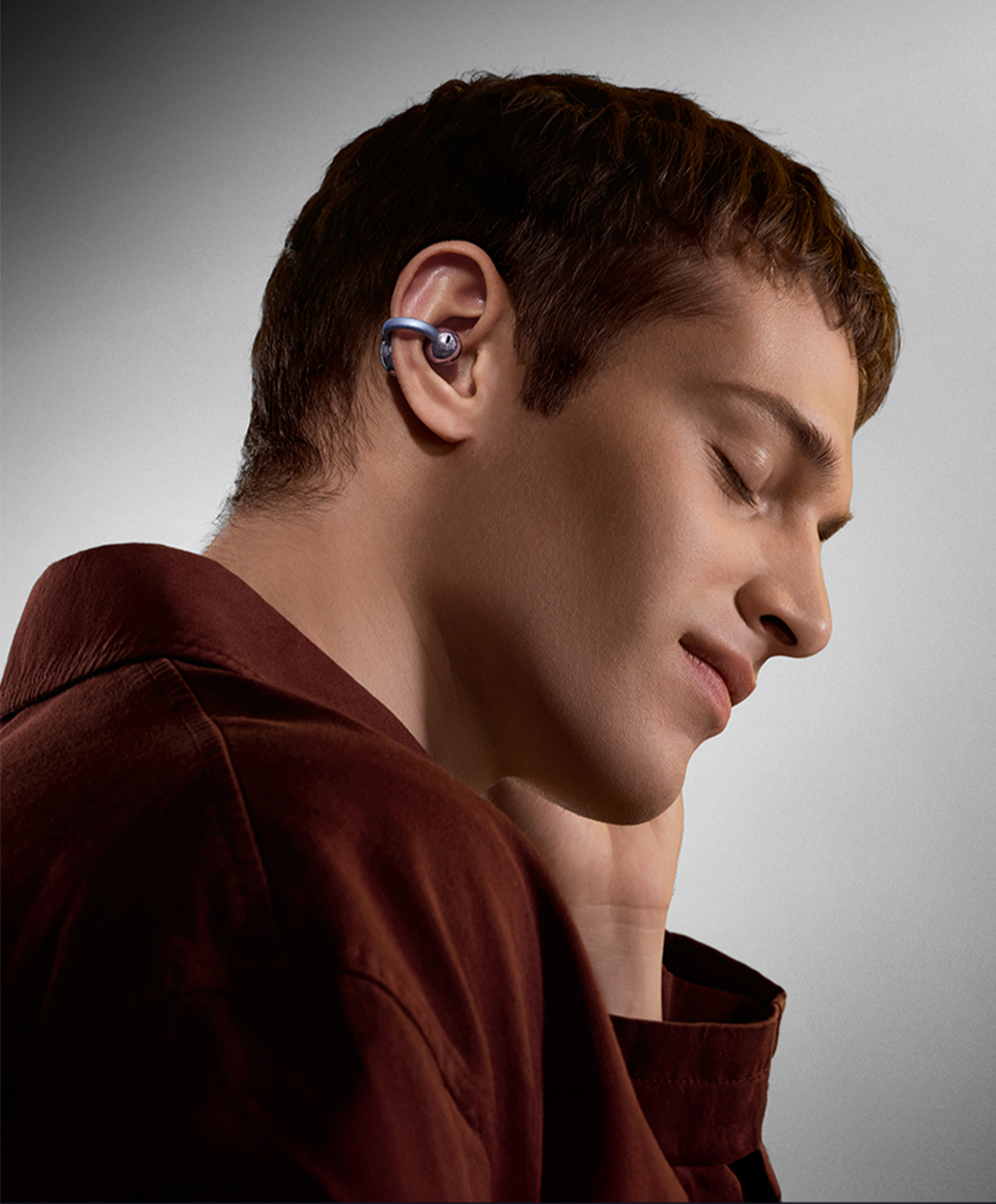Man wearing SANAG open-ear earphone comfortably